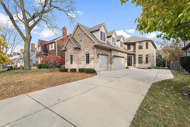 view of front of home with a front lawn and a garage