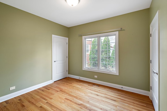 unfurnished room featuring light hardwood / wood-style flooring