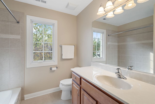 full bathroom with toilet, vanity, tile patterned floors, and tiled shower / bath