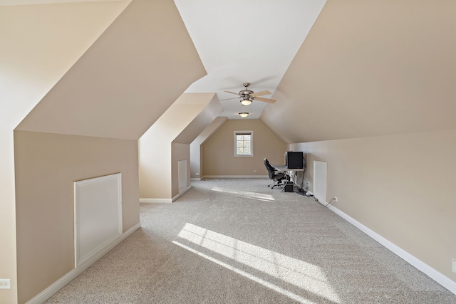 additional living space with light carpet, ceiling fan, and lofted ceiling