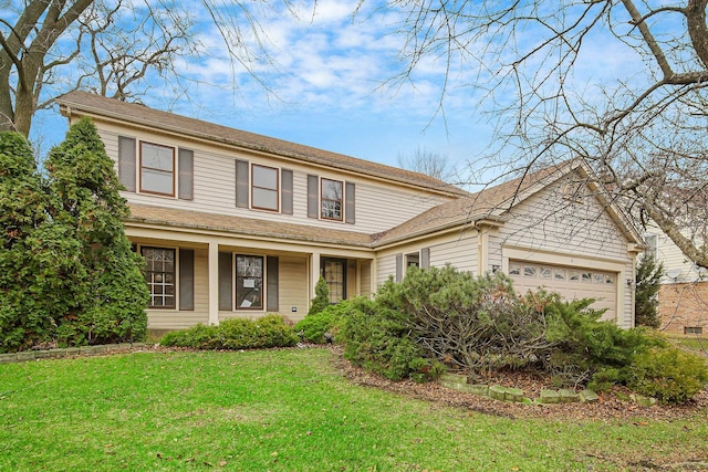 front of property with a front lawn and a garage