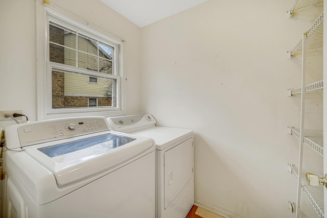 laundry area with independent washer and dryer