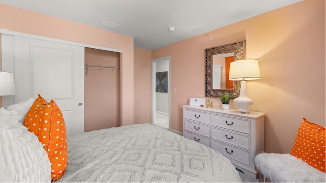 carpeted bedroom with a closet