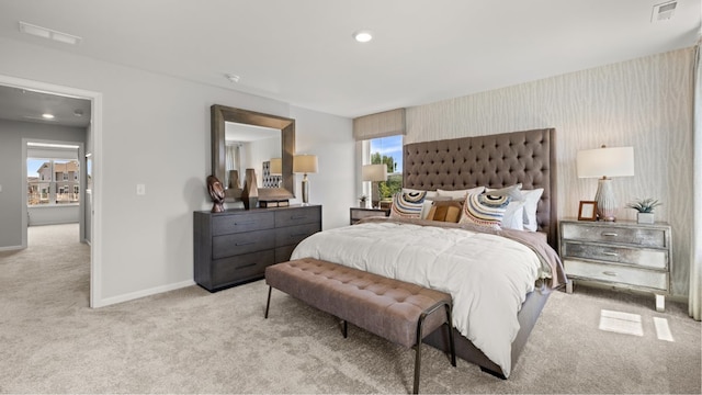 bedroom featuring light colored carpet