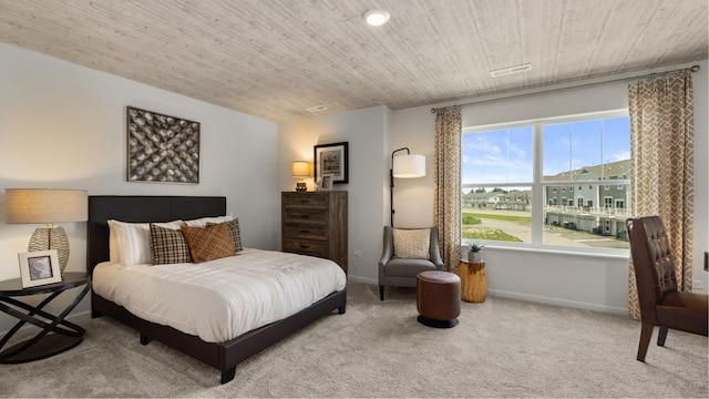 bedroom featuring light colored carpet