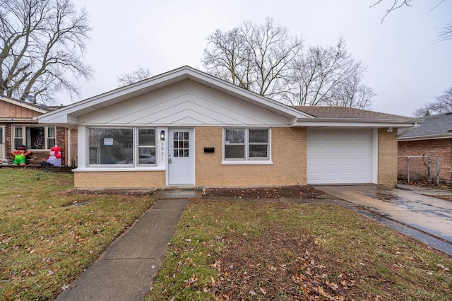 view of front of property with a garage and a front yard