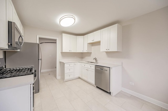 kitchen with white cabinetry, sink, and appliances with stainless steel finishes