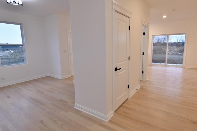 hall with light hardwood / wood-style floors