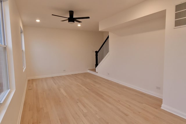 unfurnished room featuring ceiling fan and light hardwood / wood-style floors