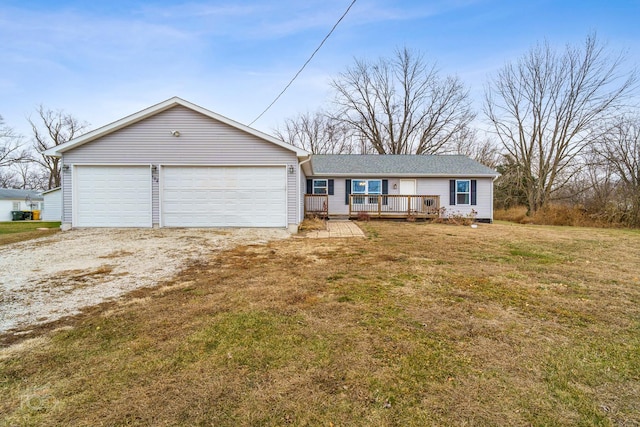 ranch-style home featuring a front yard, a garage, and a wooden deck