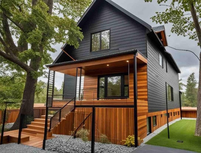 view of home's exterior with a yard and covered porch