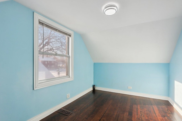 bonus room with dark hardwood / wood-style floors and lofted ceiling