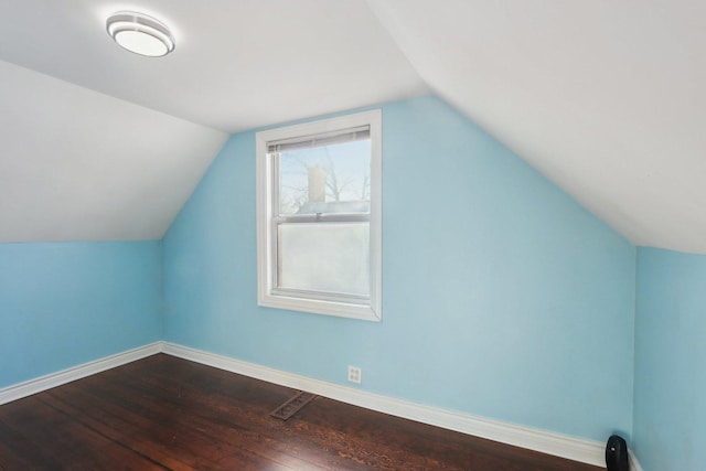 bonus room with hardwood / wood-style floors and lofted ceiling