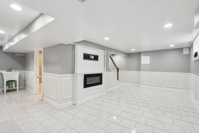 basement featuring light tile patterned floors