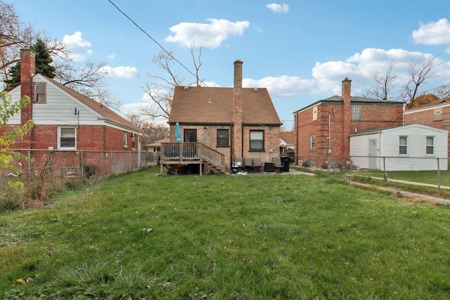 rear view of house featuring a yard