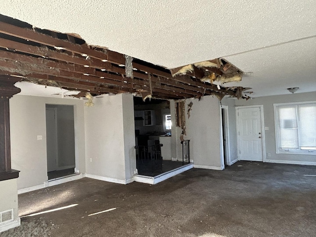 interior space featuring a textured ceiling