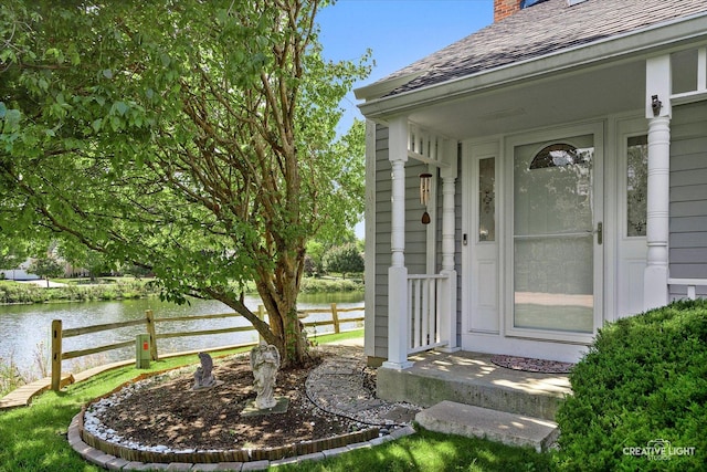 entrance to property with a water view