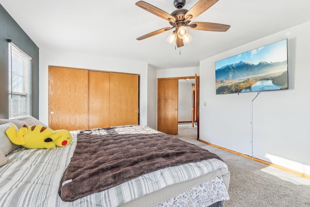 carpeted bedroom featuring ceiling fan