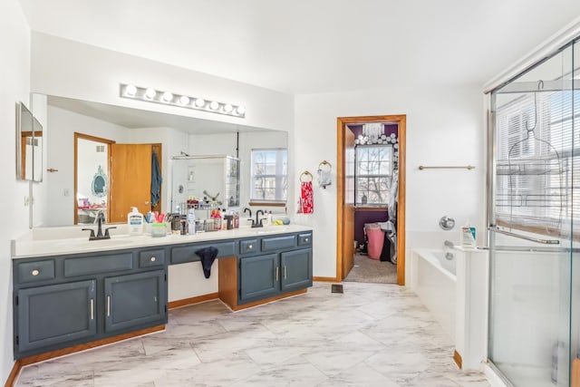 bathroom with vanity and separate shower and tub