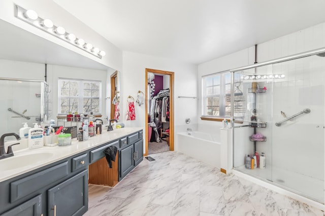 bathroom featuring plus walk in shower and vanity