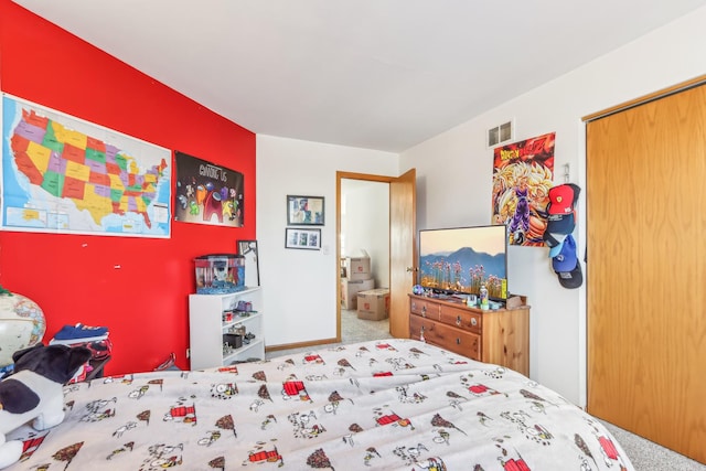 carpeted bedroom with a closet