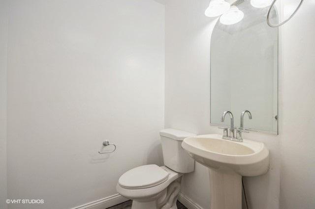 bathroom with sink and toilet