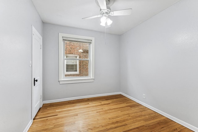 empty room featuring ceiling fan and light hardwood / wood-style floors