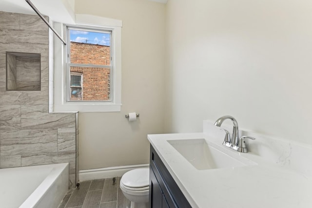 full bathroom featuring plus walk in shower, hardwood / wood-style floors, vanity, and toilet