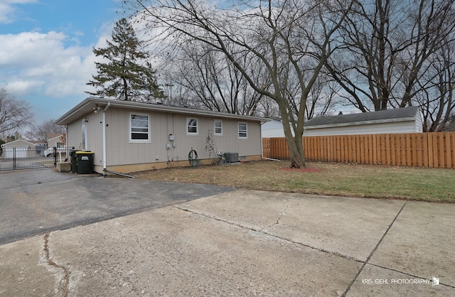 back of house with a lawn