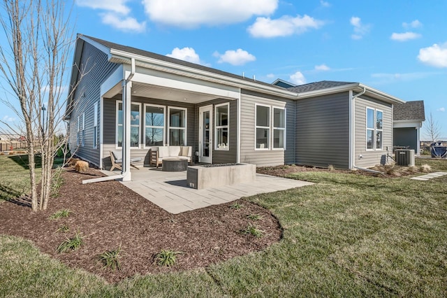 rear view of house with a yard, an outdoor hangout area, a patio, and cooling unit