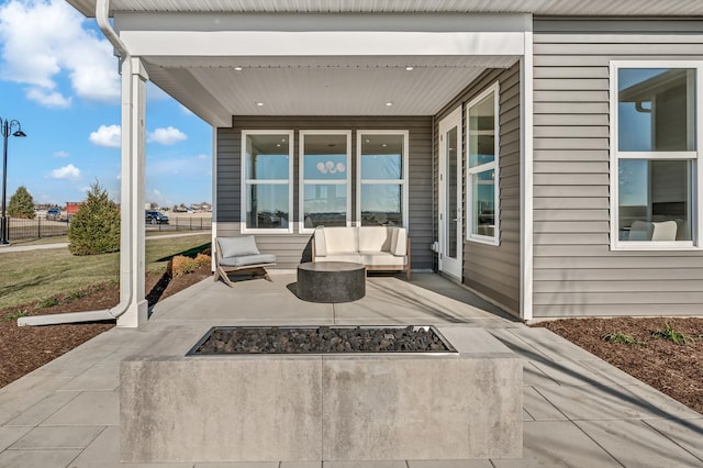 view of patio with an outdoor fire pit