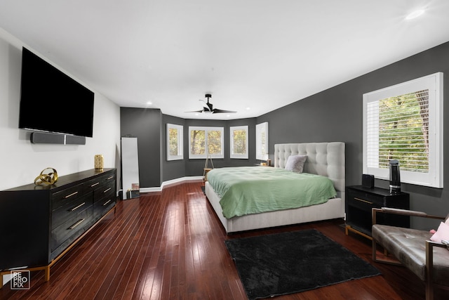 bedroom with ceiling fan and dark wood-type flooring