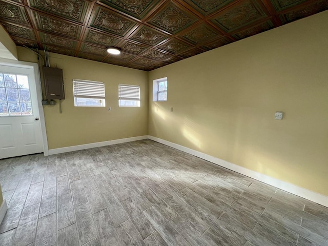 empty room featuring wood-type flooring and electric panel