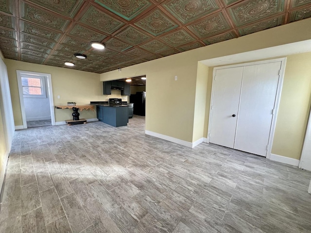 unfurnished living room with wood-type flooring