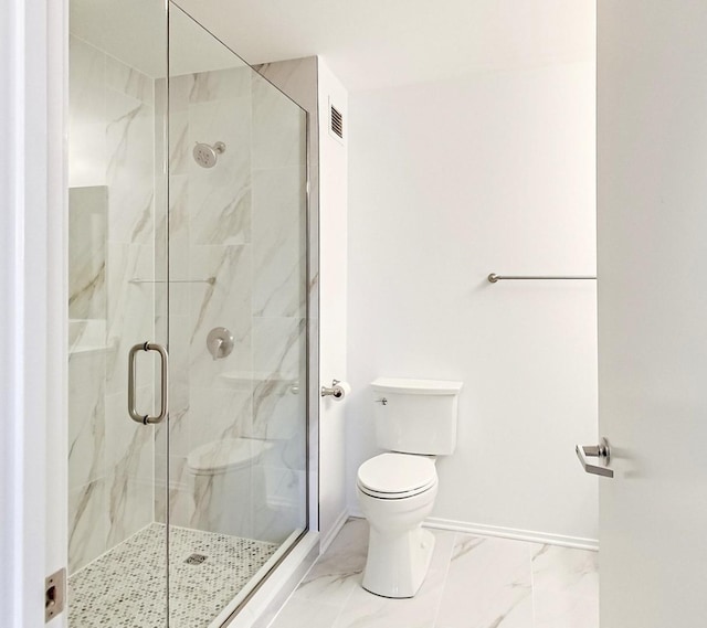 bathroom with toilet and walk in shower