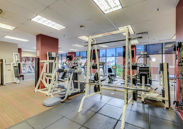 workout area with a drop ceiling