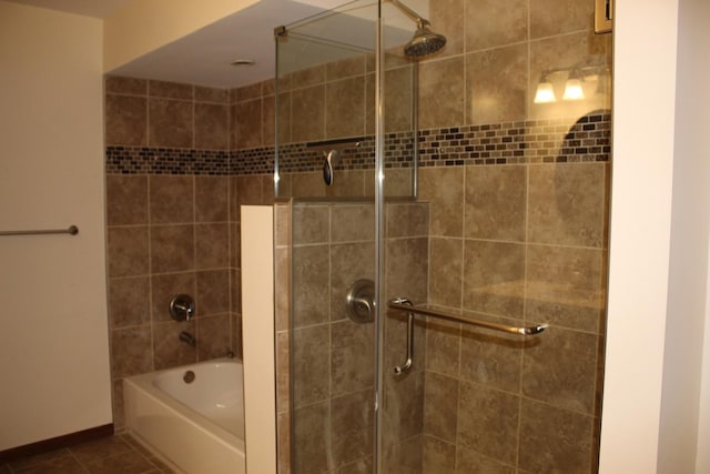 bathroom with tile patterned flooring and plus walk in shower