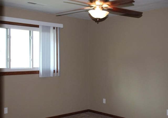 unfurnished room with ceiling fan