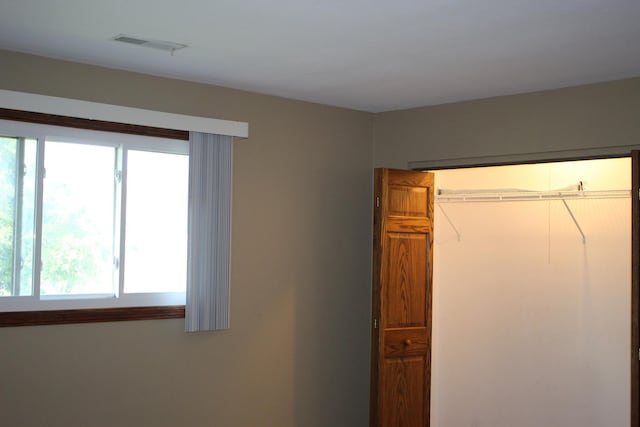 unfurnished bedroom featuring a closet