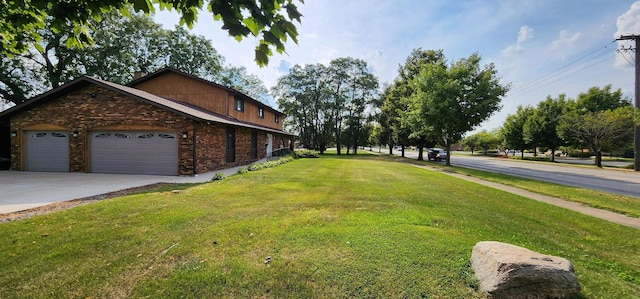 exterior space featuring a lawn and a garage