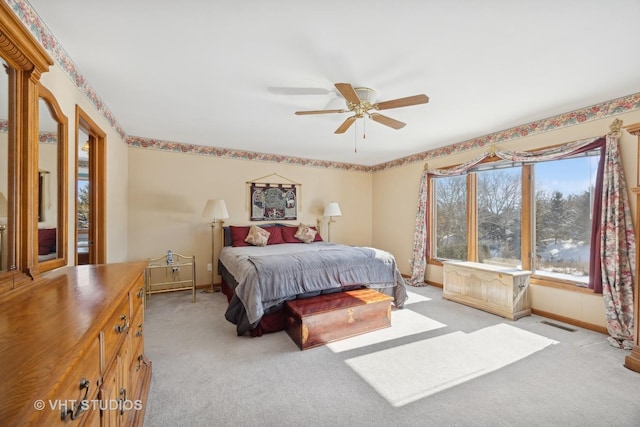 bedroom with light colored carpet and ceiling fan