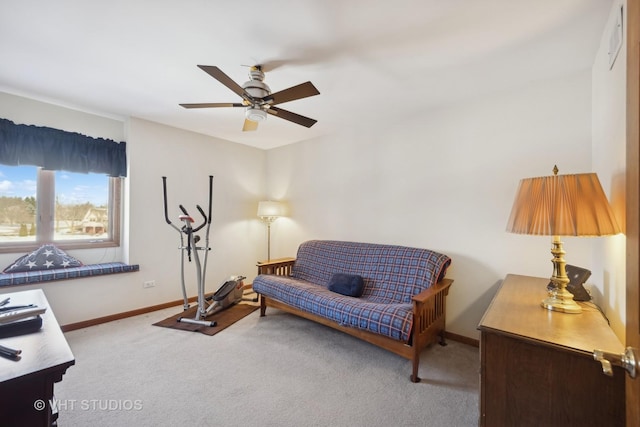 living area featuring ceiling fan and light colored carpet