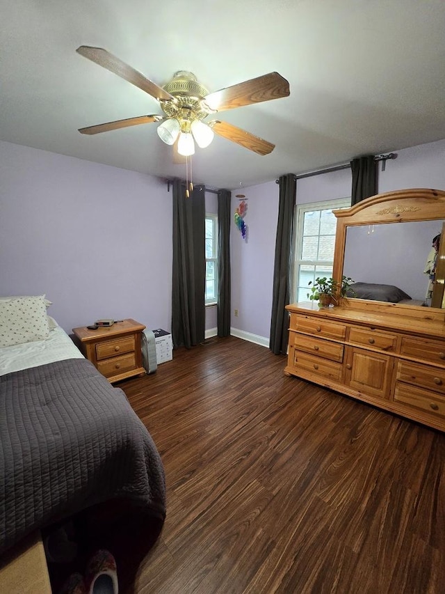 bedroom featuring ceiling fan and dark hardwood / wood-style floors