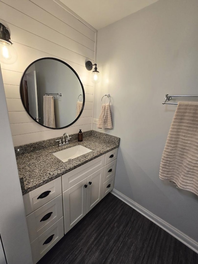 bathroom featuring vanity and wood-type flooring