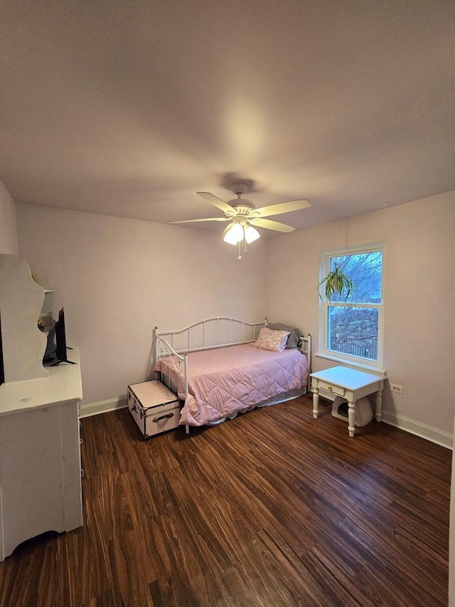 bedroom with ceiling fan and dark wood-type flooring