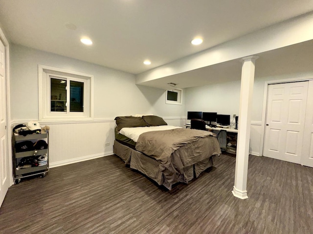 bedroom featuring a closet and dark wood-type flooring