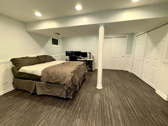 bedroom with dark hardwood / wood-style flooring