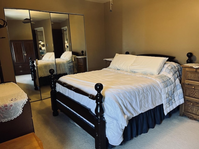 carpeted bedroom with a closet