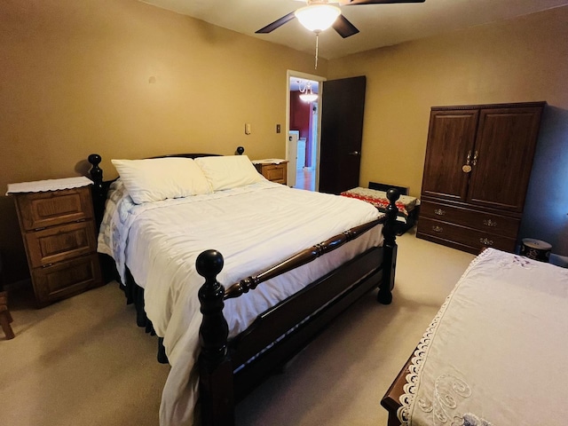 bedroom featuring light colored carpet and ceiling fan