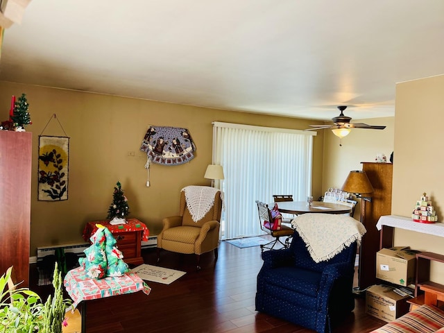 living room with dark hardwood / wood-style flooring, a baseboard radiator, and ceiling fan